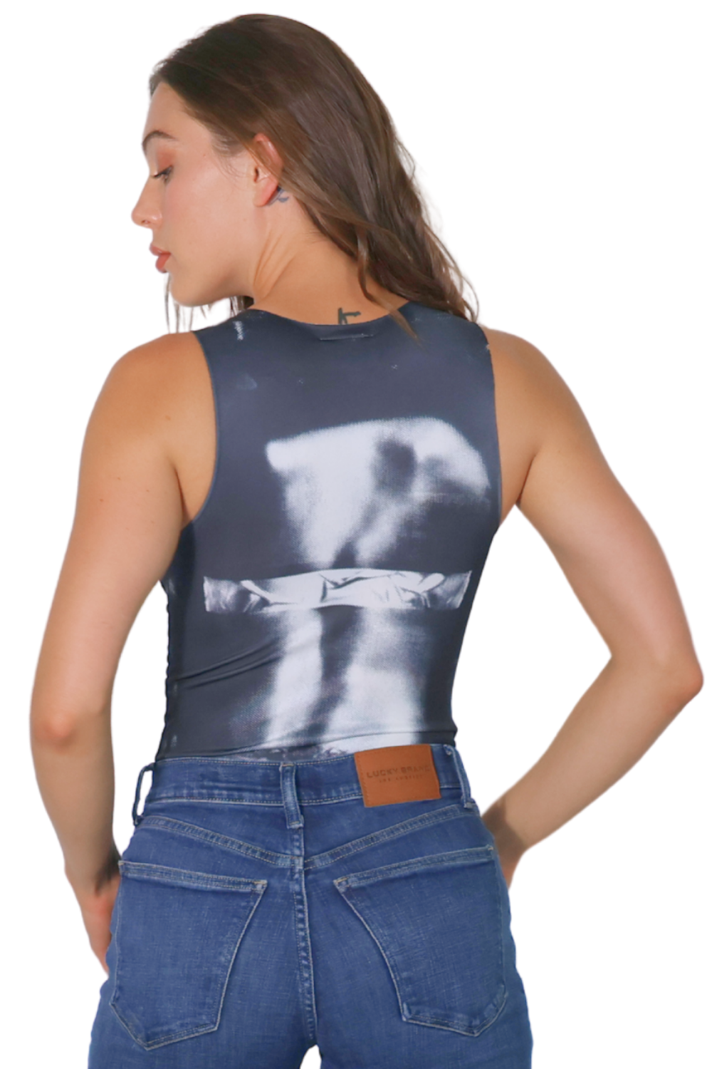 Woman wearing a sleeveless top with a graphic design on a white background
