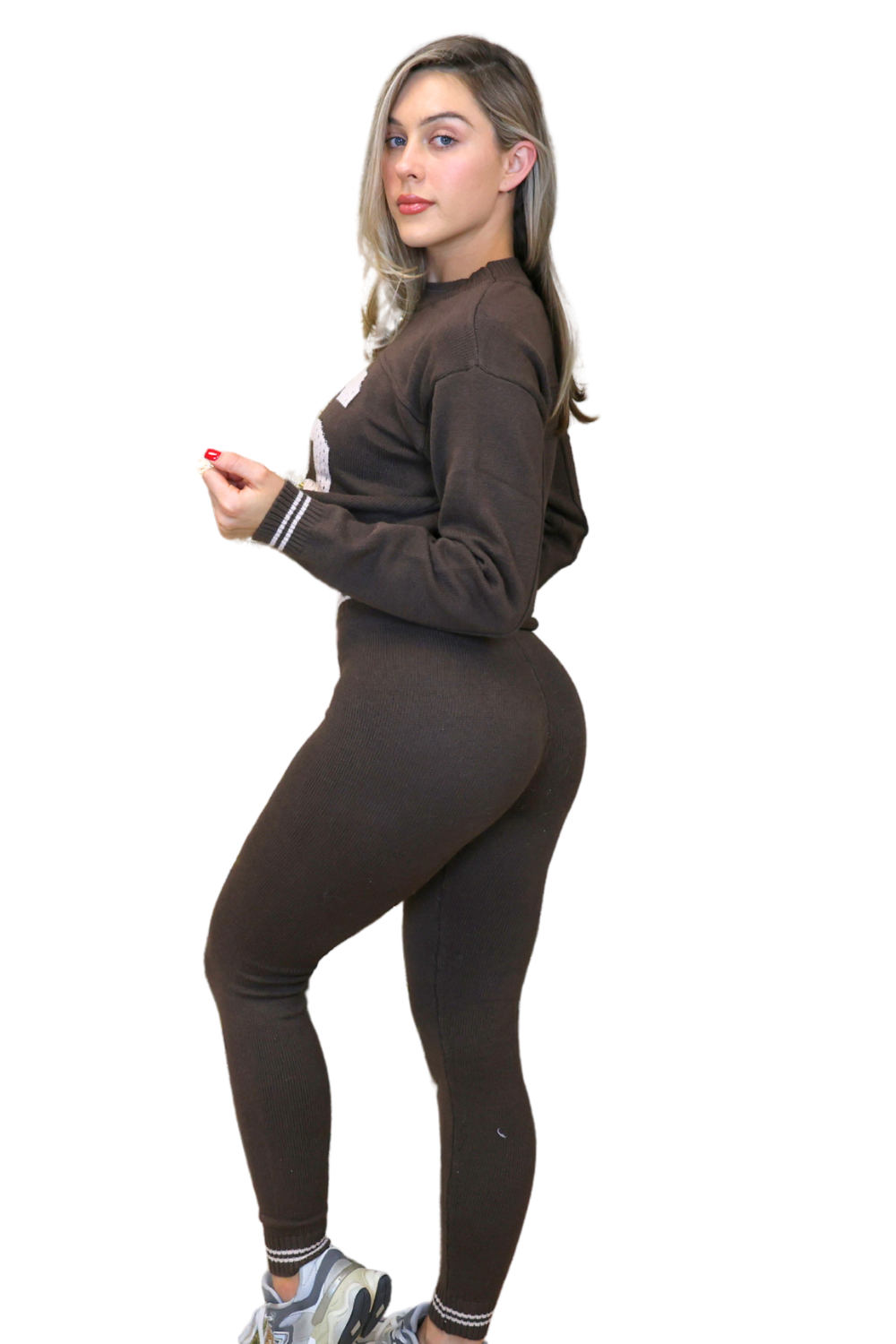 Woman wearing a brown tracksuit on a white background